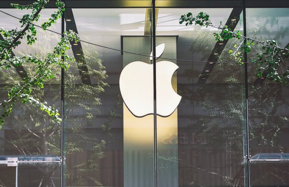 An image of the Apple logo hanging in a building